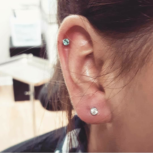 Explore flower spine tattoo ideas, creative tattoo ideas in North Charleston, available at Exotic Impressions Body Piercing