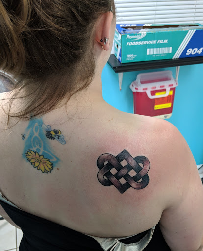 Explore brass knuckle tattoo ideas, creative tattoo ideas in Myrtle Beach, available at Myrtle Beach Ink