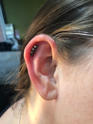 Explore oshun tattoo ideas, creative tattoo ideas in Addison, available at Cat Tattoo