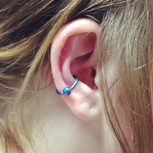 Explore smile tattoo ideas, creative tattoo ideas in Oswego, available at Bodified