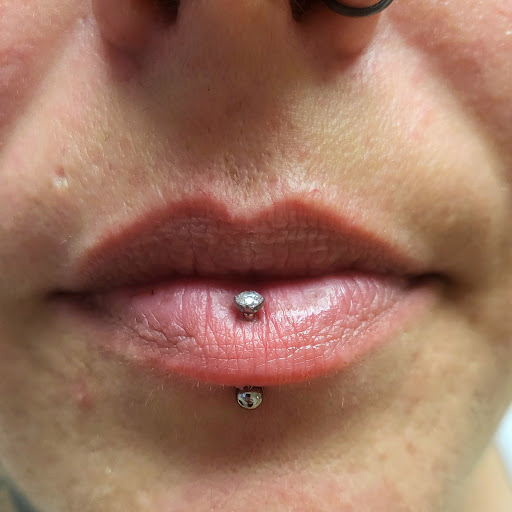 Explore stomach tattoo ideas, creative tattoo ideas in Memphis, available at Rose Quartz Body Adornment LLC