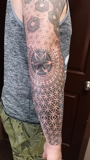 Explore flower tattoo ideas for females, creative tattoo ideas in Swannanoa, available at Iron Wolves Tattoo