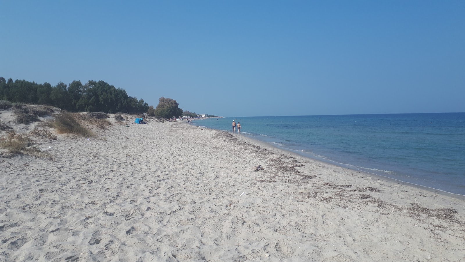 Photo of Golden beach with partly clean level of cleanliness