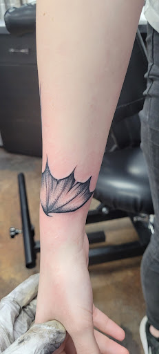 Explore butterfly leg tattoo ideas, creative tattoo ideas in Minneapolis, available at Scottish Rose Tattoo
