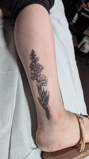 Find chest tattoo ideas for women for your next unique tattoo in Rochester at Axe of Kindness Tattoo