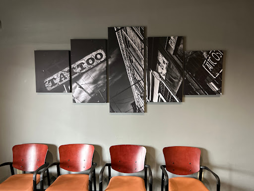 Explore snake tattoo ideas for men, creative tattoo ideas in Hubbard, available at Rise Above Tattoo