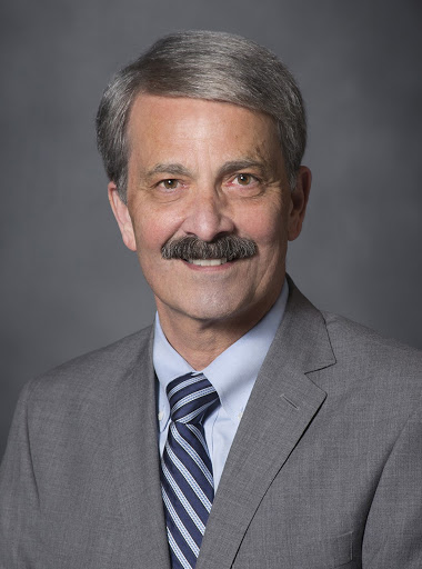 John M. De Triquet, MD