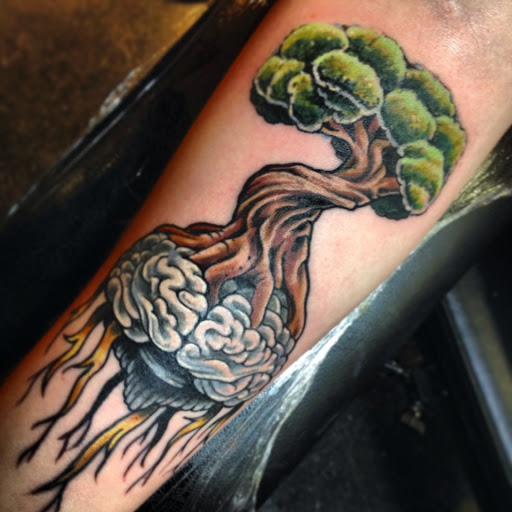 Explore snail tattoo ideas, creative tattoo ideas in Dekalb, available at Proton Tattoo
