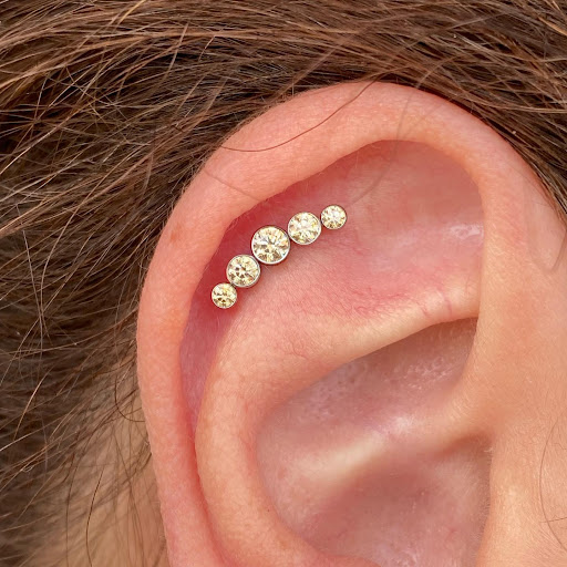 Explore tan tattoo ideas, creative tattoo ideas in Dover, available at Agap Body Piercings