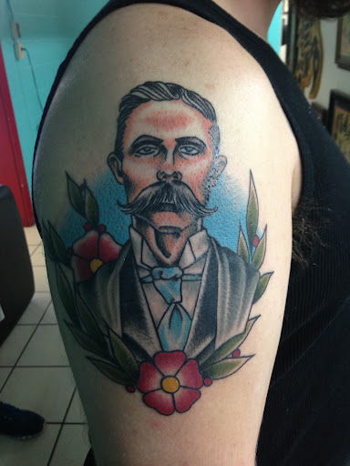 Explore female spine tattoo ideas, creative tattoo ideas in Georgetown, available at Iron Rite Tattoo South