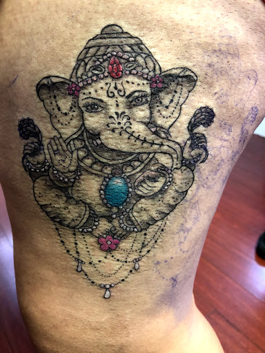 Explore tiger lily tattoo ideas, creative tattoo ideas in Dalton, available at Unkut Productions Inc Tattoo Piercing Studio