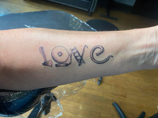 Find dog tattoo idea for your next unique tattoo in Canton at The Inkeepers Tattoo Parlor