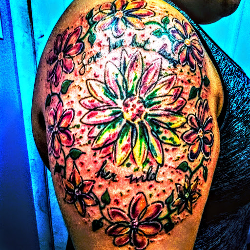 Explore matching father and son tattoo ideas, creative tattoo ideas in Bridgeport, available at Pike Street Studios Tattoo and Body Piercing