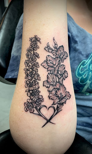 Explore hand tattoo ideas for females, creative tattoo ideas in Goshen, available at Lady Luck Studio
