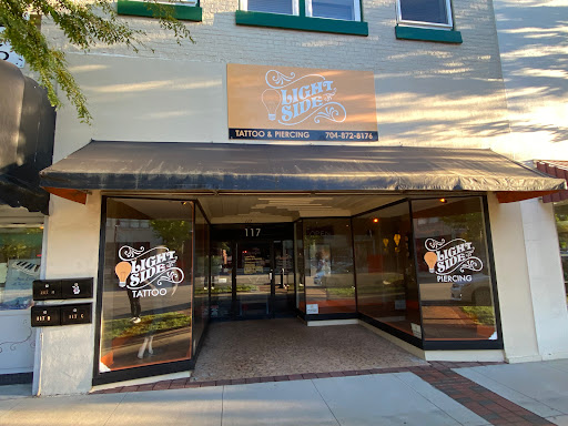 Explore men's face tattoo ideas, creative tattoo ideas in Statesville, available at Light Side Tattoo & Piercings