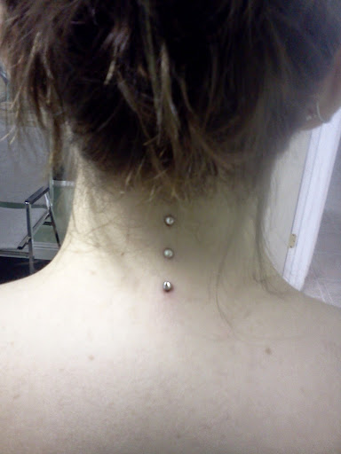 Find necklace tattoo ideas for your next unique tattoo in Summerville at Exotic Impressions Body Piercing