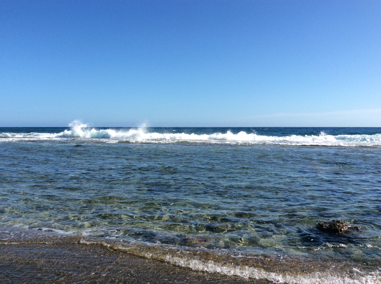 Foto van Playa de Sigua met blauw water oppervlakte