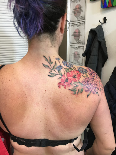 Explore angel neck tattoo ideas, creative tattoo ideas in Portland, available at Obsidian Tattoo