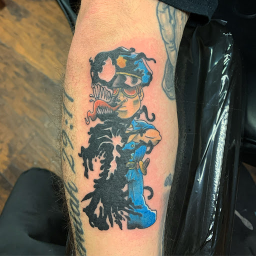 Explore leg tribal tattoo ideas, creative tattoo ideas in Kingsport, available at Raven Mocker Tattoo