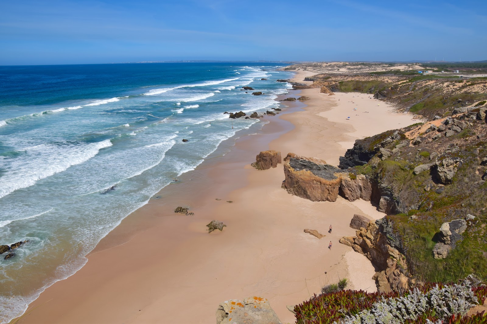 Foto de Praia de Malhão com areia fina e brilhante superfície