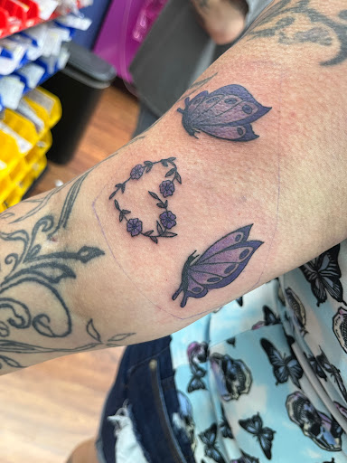 Explore twin daughter tattoo ideas, creative tattoo ideas in Cocoa, available at Rorschach Tattoo Shop and Piercing Studio