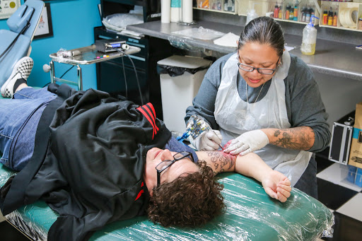 Explore dad daughter tattoo ideas, creative tattoo ideas in Stockton, available at Canvas Tattoo