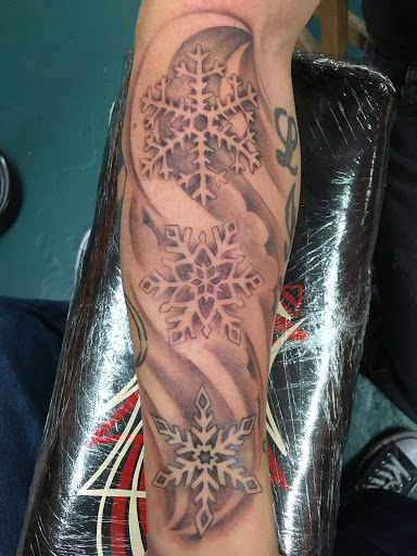 Explore flower arm tattoo ideas, creative tattoo ideas in Glenwood Springs, available at Spyder Rose Tattoo