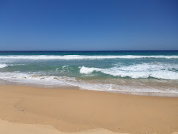 Foto van Wairo Beach gelegen in een natuurlijk gebied