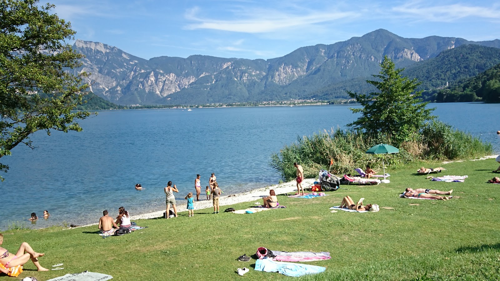Foto von Punta Indiani Beach mit gras Oberfläche