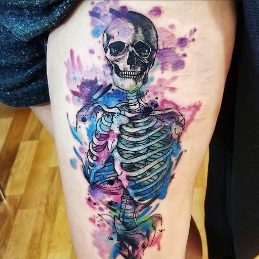 Explore under chin tattoo ideas, creative tattoo ideas in Benton, available at Spectrum Tattoo