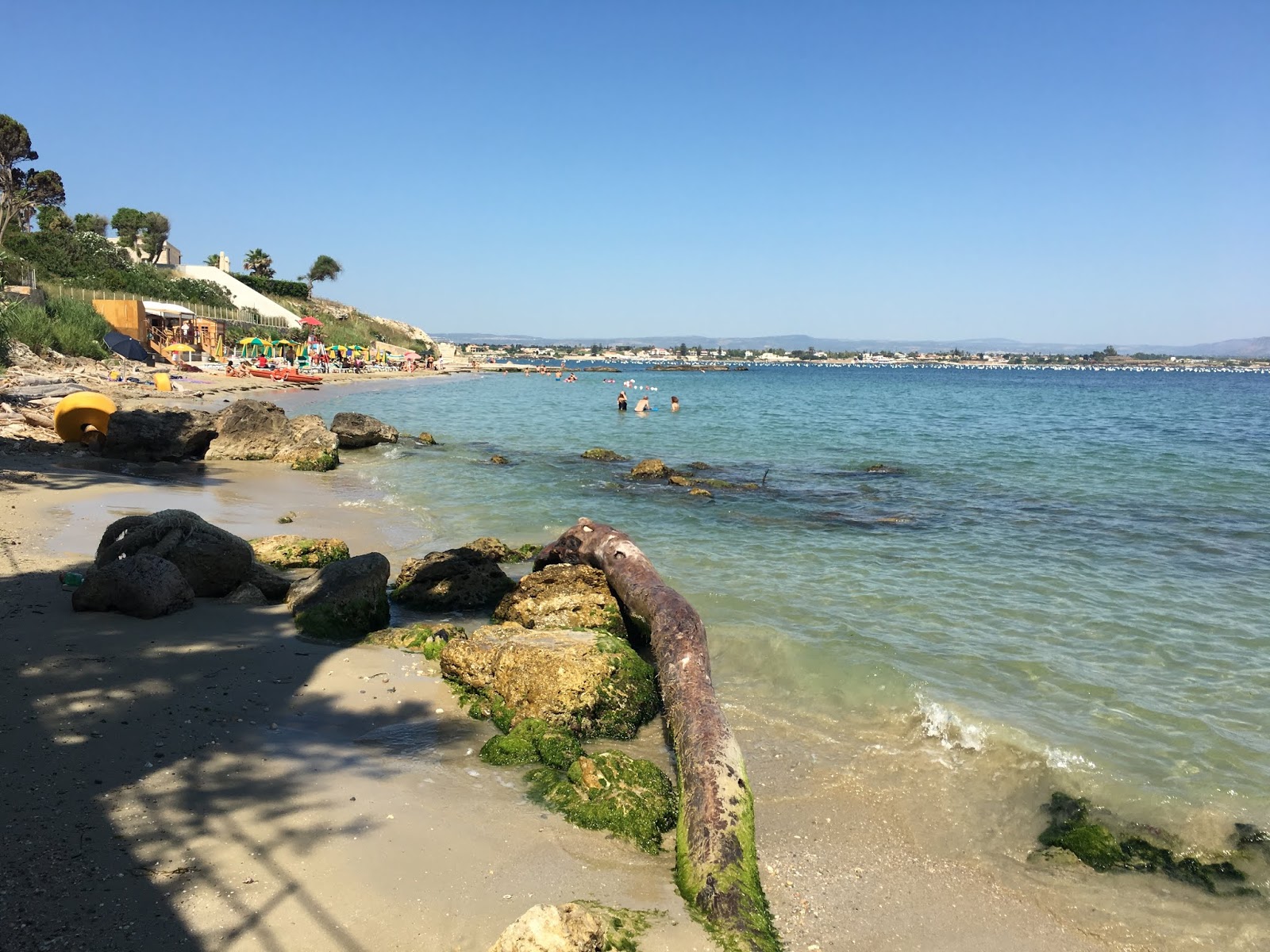 Spiaggia Punta del Pero'in fotoğrafı küçük koy ile birlikte