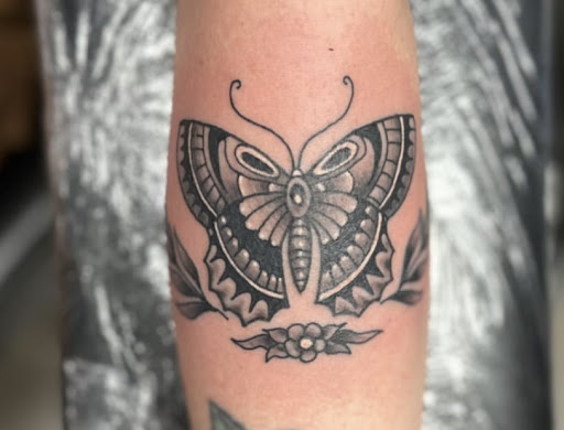 Explore red hand tattoo ideas, creative tattoo ideas in Mckinney, available at Boss Frog Tattoos