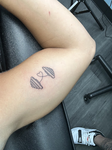 Explore dolphin tattoo ideas for females, creative tattoo ideas in Forest Hills, available at Noble Ink Tattoo Studio