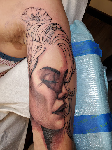 Explore couple ring tattoo ideas, creative tattoo ideas in Peoria, available at Guerrilla Ink Tattoos