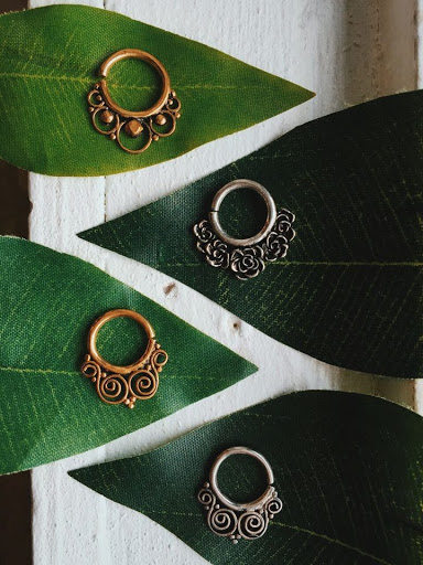 Explore spider tattoo ideas, creative tattoo ideas in Minneapolis, available at Almost Famous Body Piercing