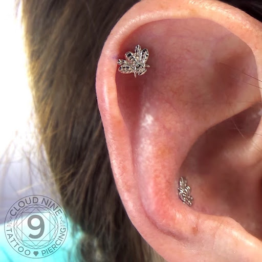 Explore red ink tattoo ideas for guys, creative tattoo ideas in Birmingham, available at Cloud 9 Tattoo & Piercing STUDIO