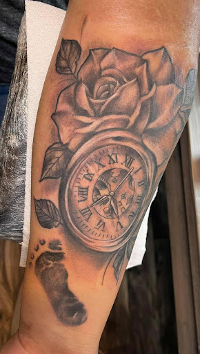 Explore men's clock tattoo ideas, creative tattoo ideas in Mayodan, available at Bleeding Ink Tattoo