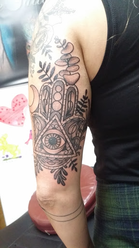 Explore pisces symbol tattoo ideas, creative tattoo ideas in Cary, available at Double Deuce Tattoo and Art Gallery