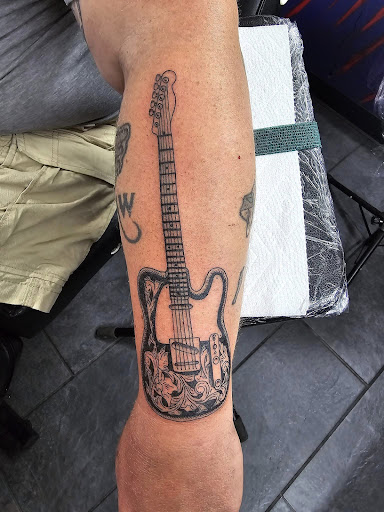 Explore holy spirit tattoo ideas, creative tattoo ideas in Cadillac, available at Warchief Tattoo, LLC