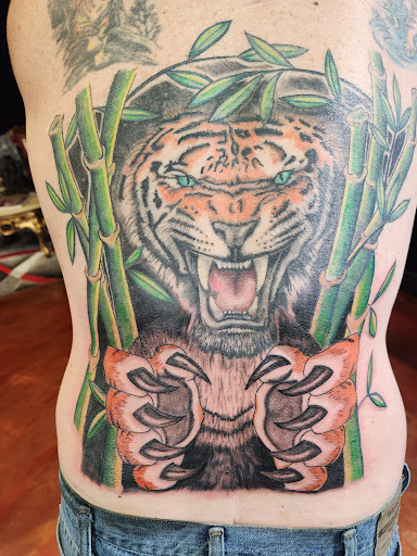 Explore mockingbird tattoo ideas, creative tattoo ideas in Inverness, available at The Perfect Spot Tattoos