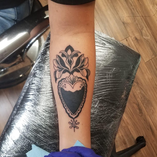 Explore tattoo ideas for son on mom, creative tattoo ideas in Hudson Falls, available at ALTERED ADDICTION TATTOOS