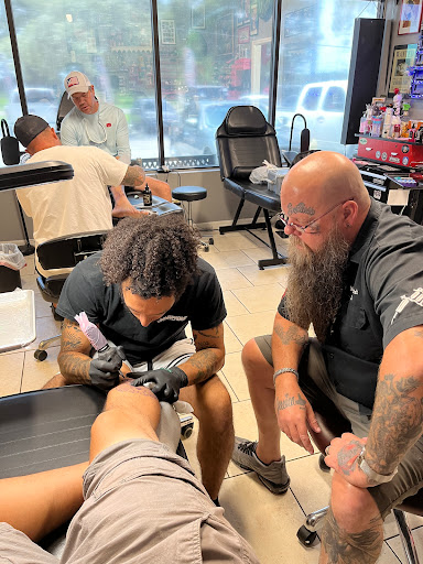 Explore carnation tattoo ideas, creative tattoo ideas in Ocoee, available at Slaughterized Ink Tattoo and Piercing Studio