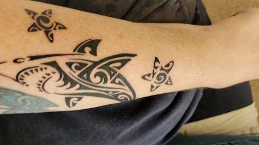 Explore dog tattoo ideas for females, creative tattoo ideas in Denver, available at Nocturnal Tattoo