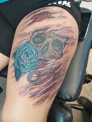 Explore dark humor tattoo ideas, creative tattoo ideas in Fort Mohave, available at RedRum Tattoo & Body Piercing Co.