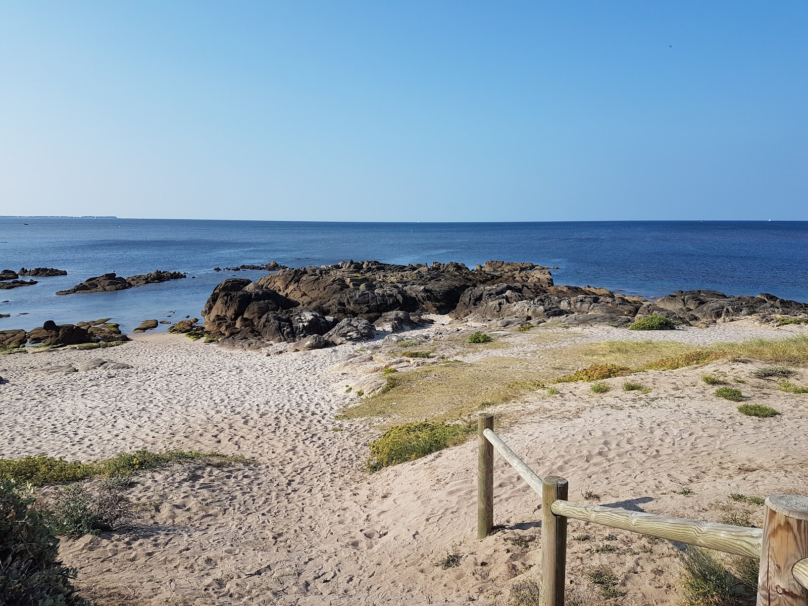 Plage Port-au-Loup的照片 - 受到放松专家欢迎的热门地点