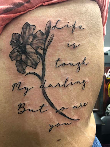 Find in between breast tattoo ideas for your next unique tattoo in Nashville at Titan Tattoo