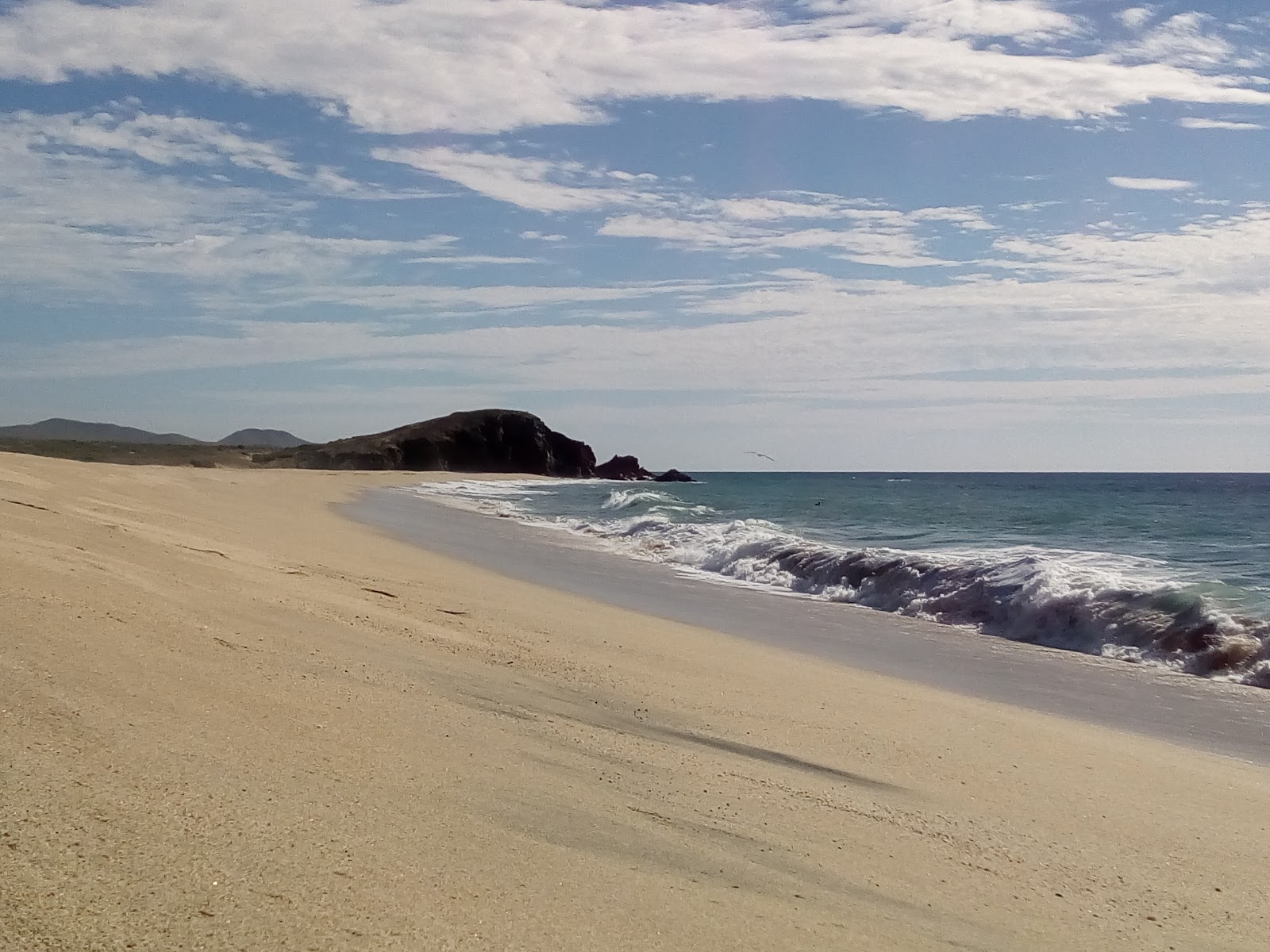 Fotografie cu Playa Coyoc cu o suprafață de apa pură turcoaz