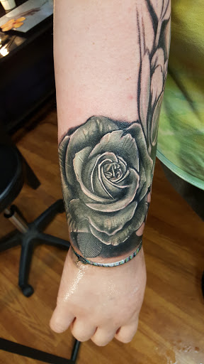 Explore chest tattoo lettering ideas, creative tattoo ideas in East Freedom, available at Midnight Ink Tattoo Parlor