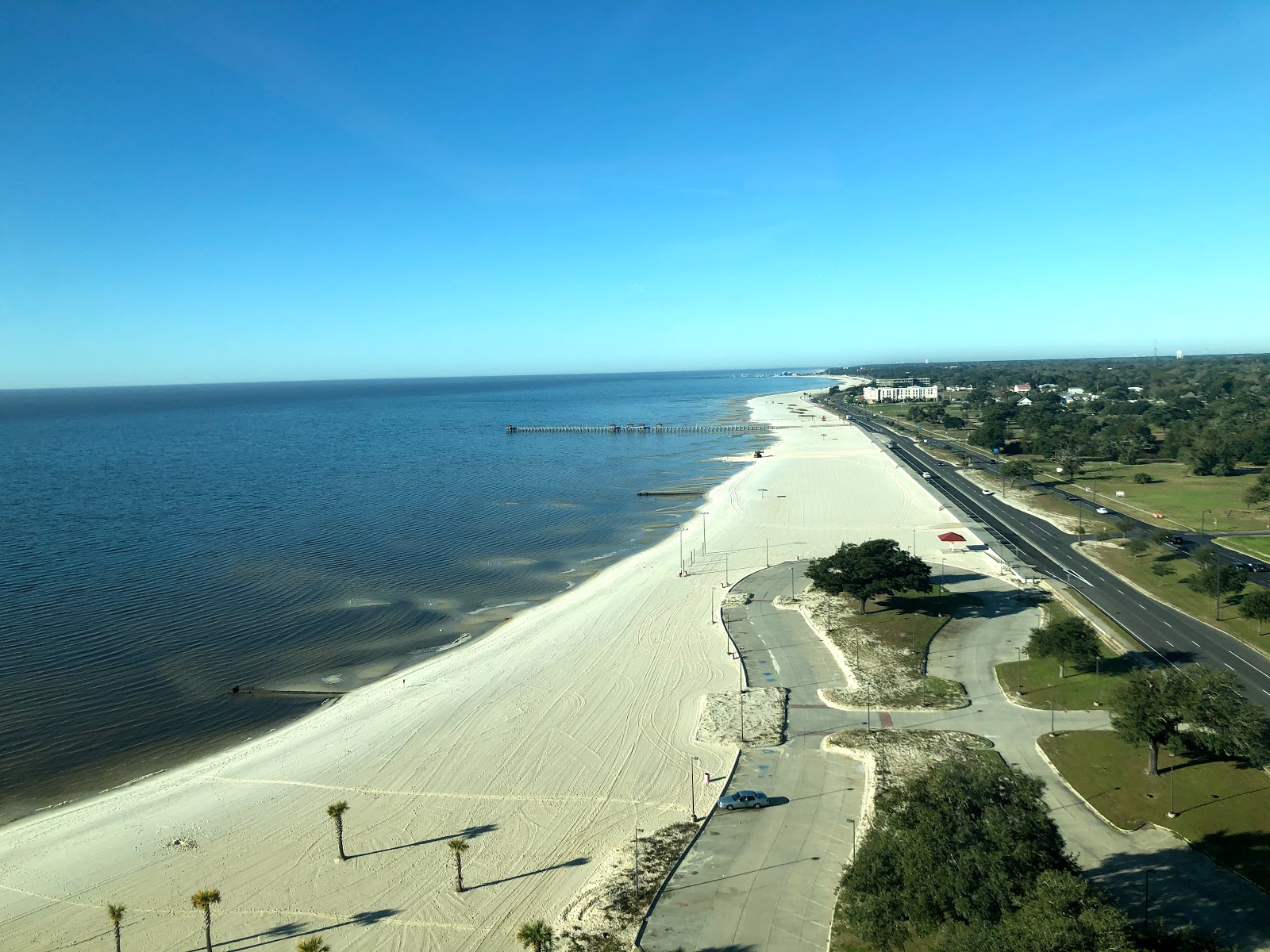 Photo of Long beach city beach with dark blue water surface