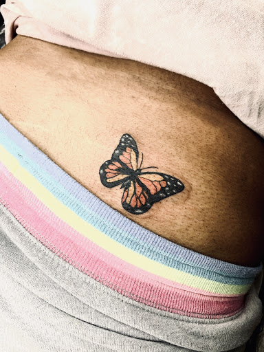 Explore scroll tattoo ideas, creative tattoo ideas in Lake City, available at Crooked Spines Tattoo Studio